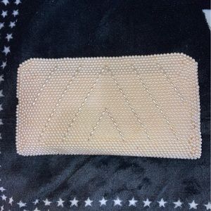 Beige beaded evening clutch